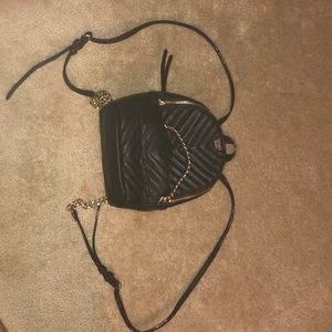 A mini black backpack/purse